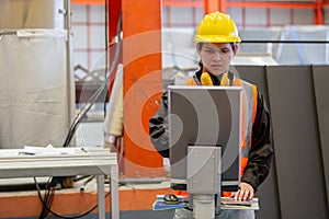 Man engineer technical working in power plant control panel of industry factory. male professional system electrician machine