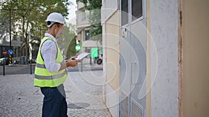 Man engineer working architect project outdoors. Foreman writing notes notepad