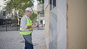 Man engineer working architect project outdoors. Foreman writing notes notepad