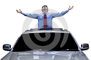 Man enjoy freedom on the sunroof of car photo