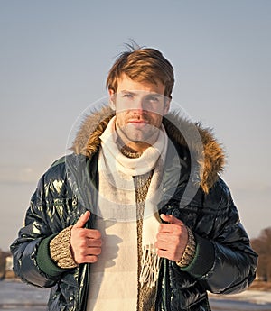 Man enjoy sunny winter day. male seasonal fashion. cold and flu. male in down coat with fur hood. feel warm and