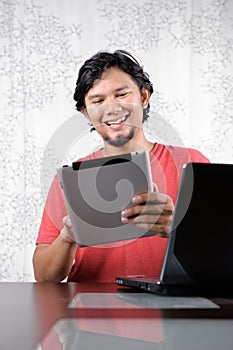 Man enjoy the tablet