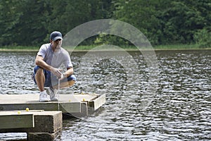 Man enjoying a beautiful day on the lake fishing