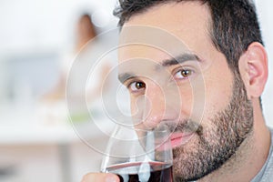 Man enjoying glass red wine