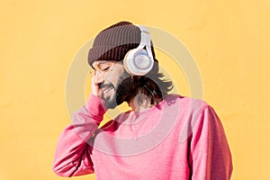 man enjoying happy the music in his headphones