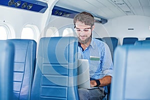 Man enjoying his journey by airplane