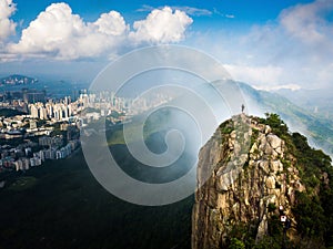 Man enjoying Hong Kong city view from the Lion rock aerial