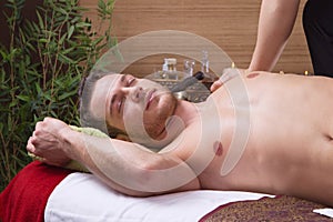 Man enjoying massage in salon