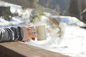 Man enjoying a mug of hot tea or coffee