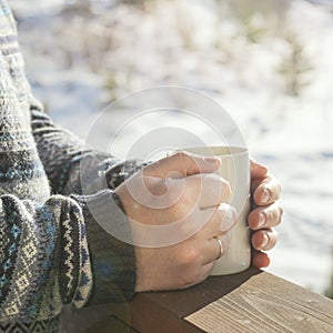 Man enjoying a mug of hot tea or coffee