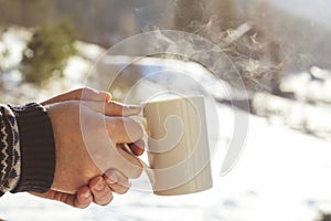 Man enjoying a mug of hot tea or coffee