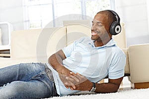 Man enjoying music on headphones photo