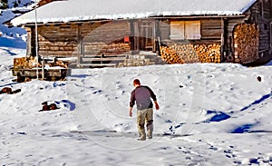 Man enjoying the snow on an alm in switzerland