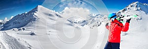 Man enjoying the stunning view before skiing in famous ski resort in Alps