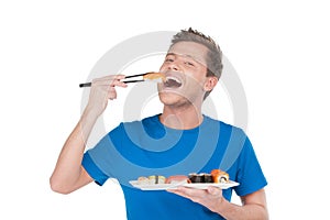 Man enjoying sushi.