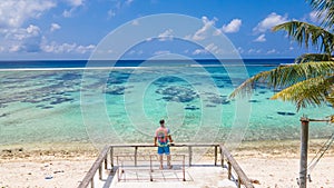 Man enjoying view at the beautiful beach at tropical island Manadhoo capital of Noonu atoll