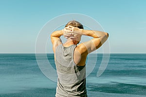 Man enjoying the view and fresh air on the ocean. Travel and a healthy lifestyle