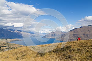 Man enjoying view from Queenstown Hill, New Zealand