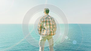 Man enjoying view of sea in summer