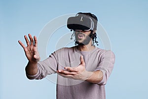 Man enjoying virtual reality leisure activity and exploring cyberspace