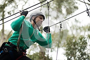 Man enjoying zip line adventure in park