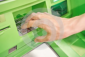 Man enter pin code at ATM security keyboard. Service people hand. Credit service
