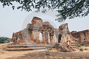 Man entering the ruins of old temple in Bagan, Myanmar