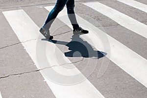 Man enters the crosswalk on the road