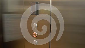 Man enters the elevator, then attach his plastic key card in elevator in order to unlock ability to enter his floor