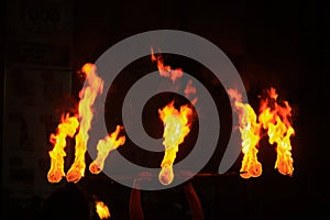 Man entertains the audience with the help of fire during the perehera in srilanka