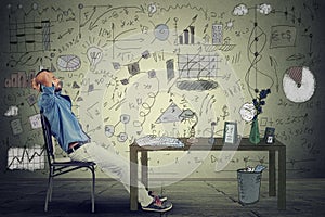 Man entrepreneur relaxing at his desk in his office photo