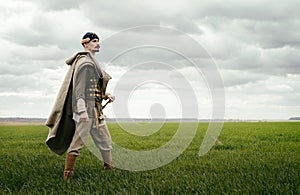 Man in ethnic suit in context of historical reconstruction