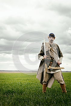 Man in ethnic suit in context of historical reconstruction