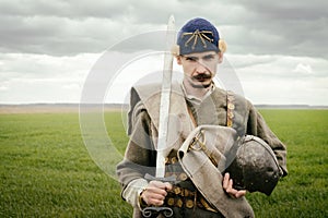 Man in ethnic suit in context of historical reconstruction