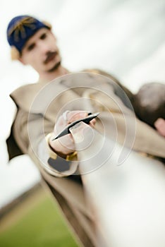 Man in ethnic suit in context of historical reconstruction