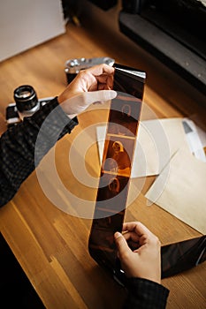 Man examines a medium format vintage film