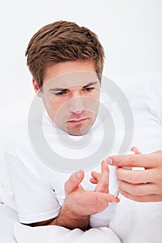 Man examining blood sugar level