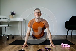 Man Excercising Yoga At Home, Mature Man Doing Yoga At Home