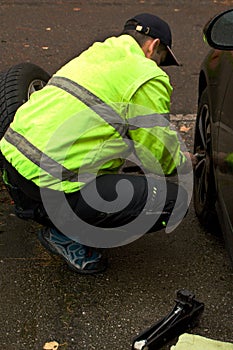 The man exchanges the seasonal wheels