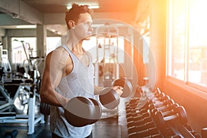 Man Execute Exercise with Dumbbells in Gym