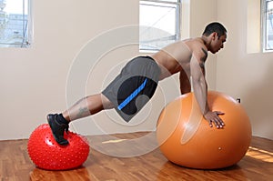 Man with exercise balls