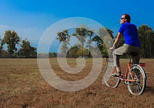 A man exercises on a bicycle