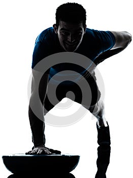 Man exercising bosu push ups fitness posture