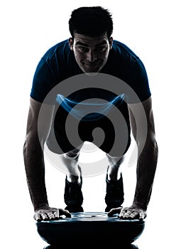 Man exercising bosu push ups workout fitness posture