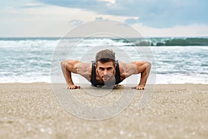 Man Exercising, Doing Push Up Exercises On Beach. Fitness Workout
