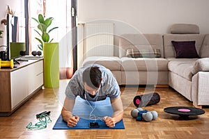 Man exercising doing workout at home