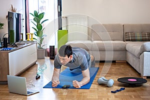 Man exercising doing workout at home