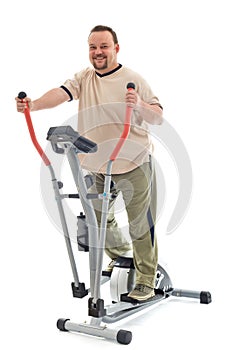 Man exercising on elliptical trainer