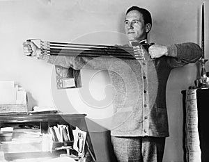 Man exercising in his office photo