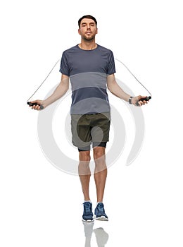 man exercising with jump rope